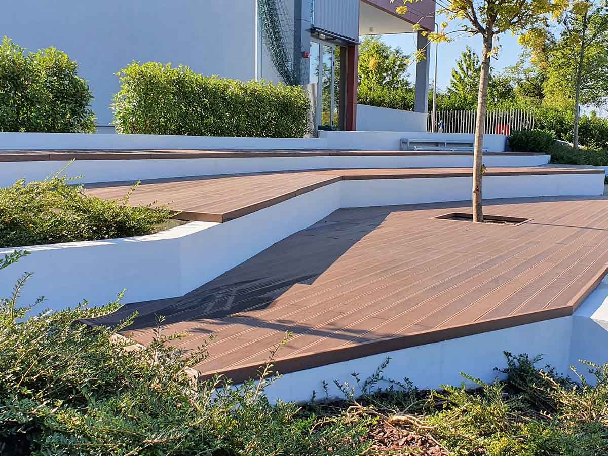 Tiered terrace and tree platform finished with Classic Line composite decking
